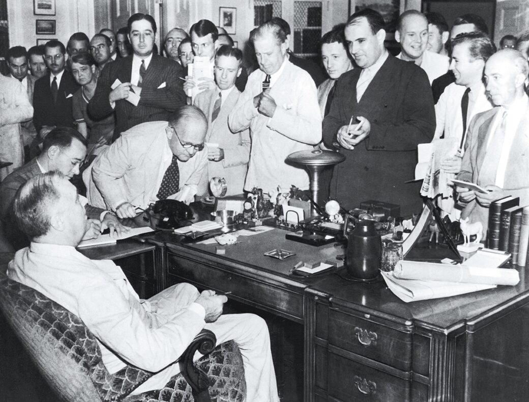 Reporters at President Roosevelt's desk in 1944 White House Historical Association