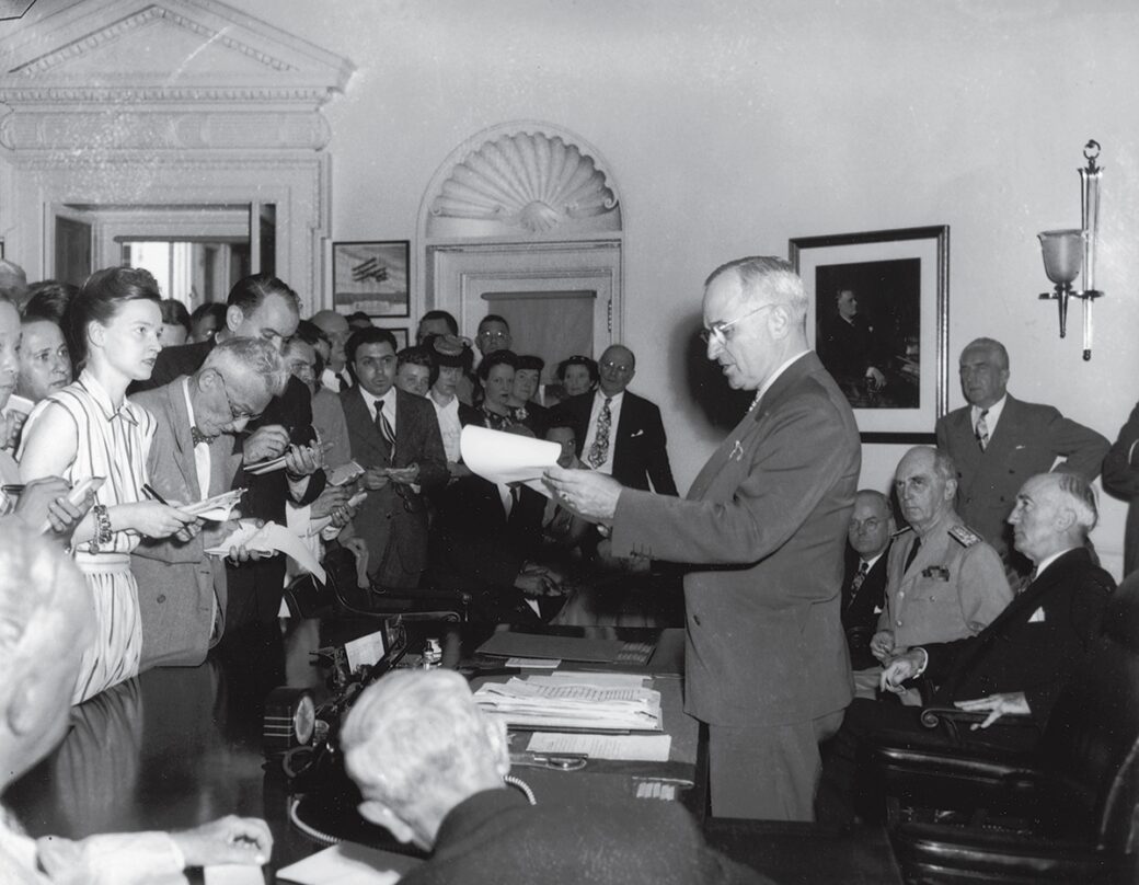Reporters at the president's desk in 1945 White House Historical